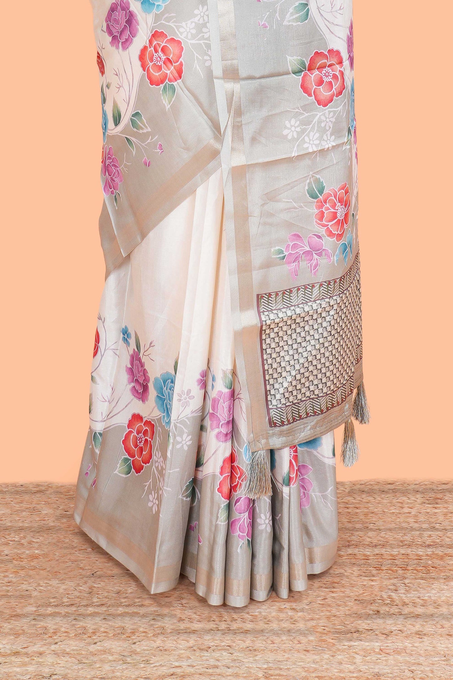 Cream floral vines art tussar saree with contrast pastel green blouse and border