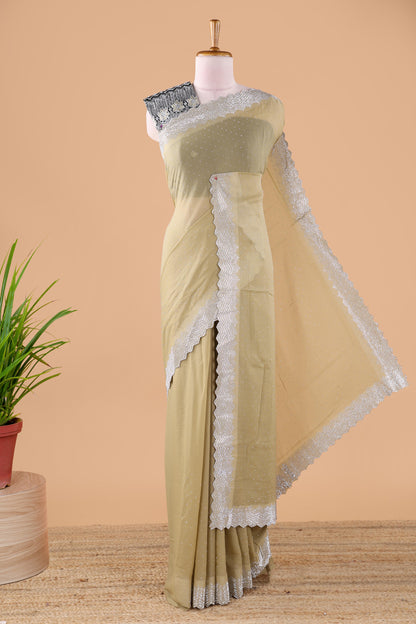 Green designer georgette space silk saree with heavy stone & beads work, short pallu and contrast sequin embroidered blouse