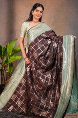 Dark brown checked floral motifs design semi soft silk saree with contrast border and blouse