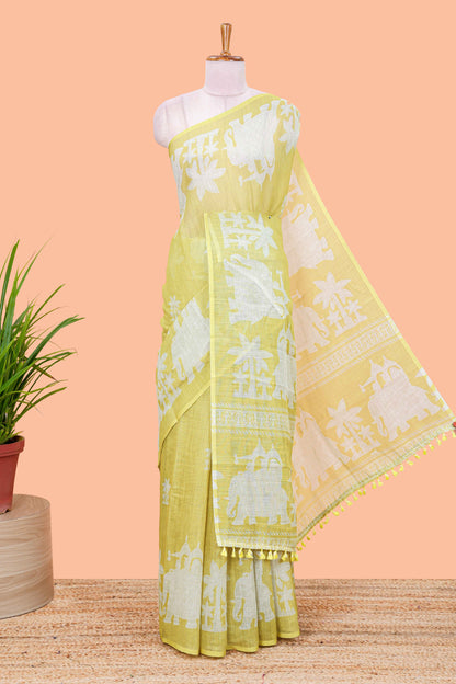 Lemon yellow linen cotton palm tree and elephant print saree with self border and matching printed blouse