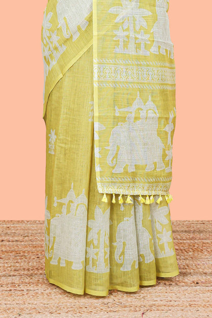 Lemon yellow linen cotton palm tree and elephant print saree with self border and matching printed blouse