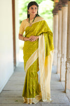 Green checked art silk saree with contrast zari border and blouse