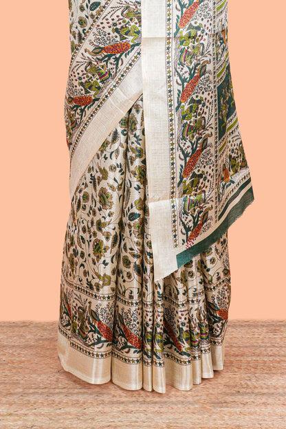 Cream khadi cotton saree with green kalamkari print on body and pallu