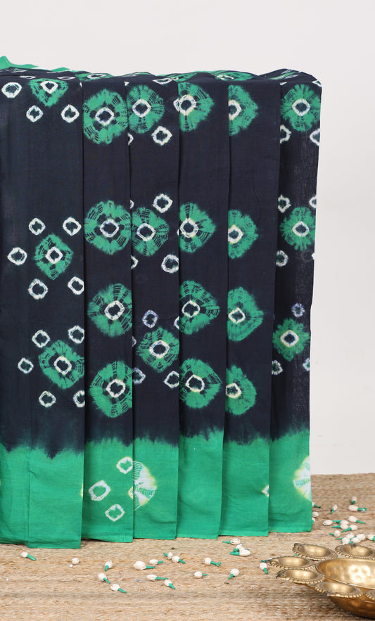 Navy blue batik print sungudi cotton saree with contrast batik border and pallu