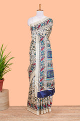 Cream south cotton saree with green kalamkari print on body, pallu contrast blue blouse