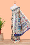 Cream south cotton saree with green kalamkari print on body, pallu contrast blue blouse