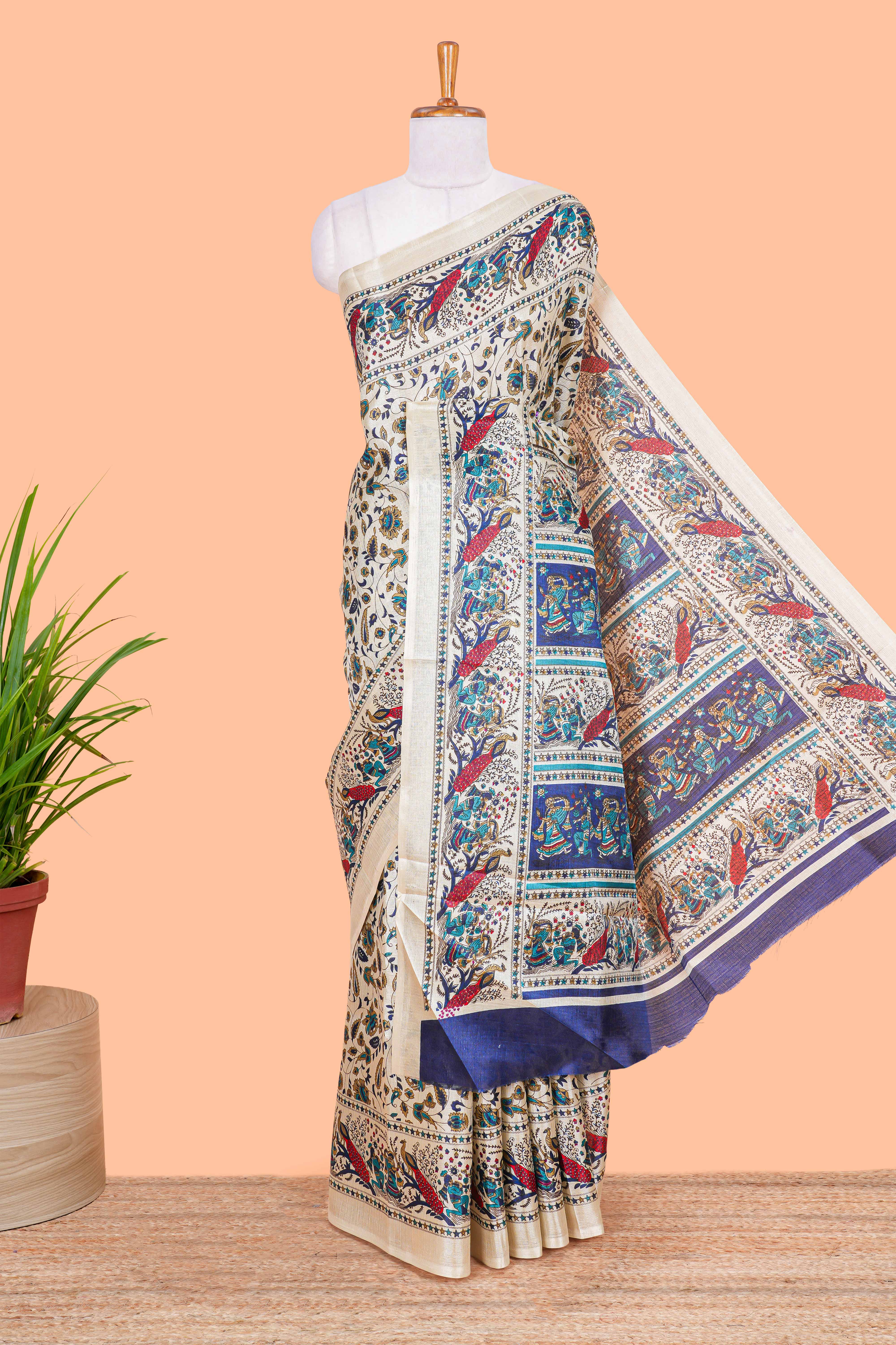 Cream south cotton saree with green kalamkari print on body, pallu contrast blue blouse