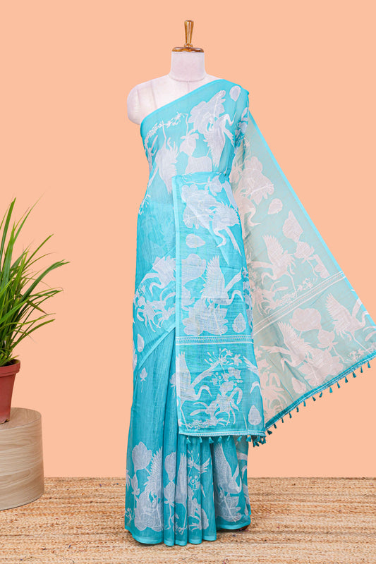 Turquoise green linen cotton floral and crane birds print saree with self border and matching printed blouse