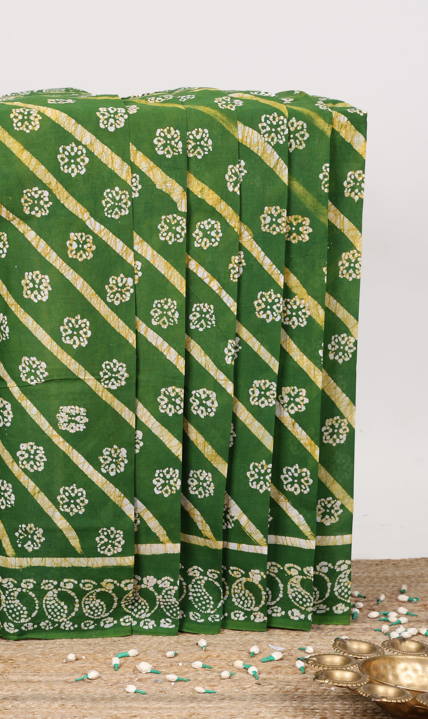 Green horizontal stripes and floral batik print sungudi cotton saree with self batik border and pallu