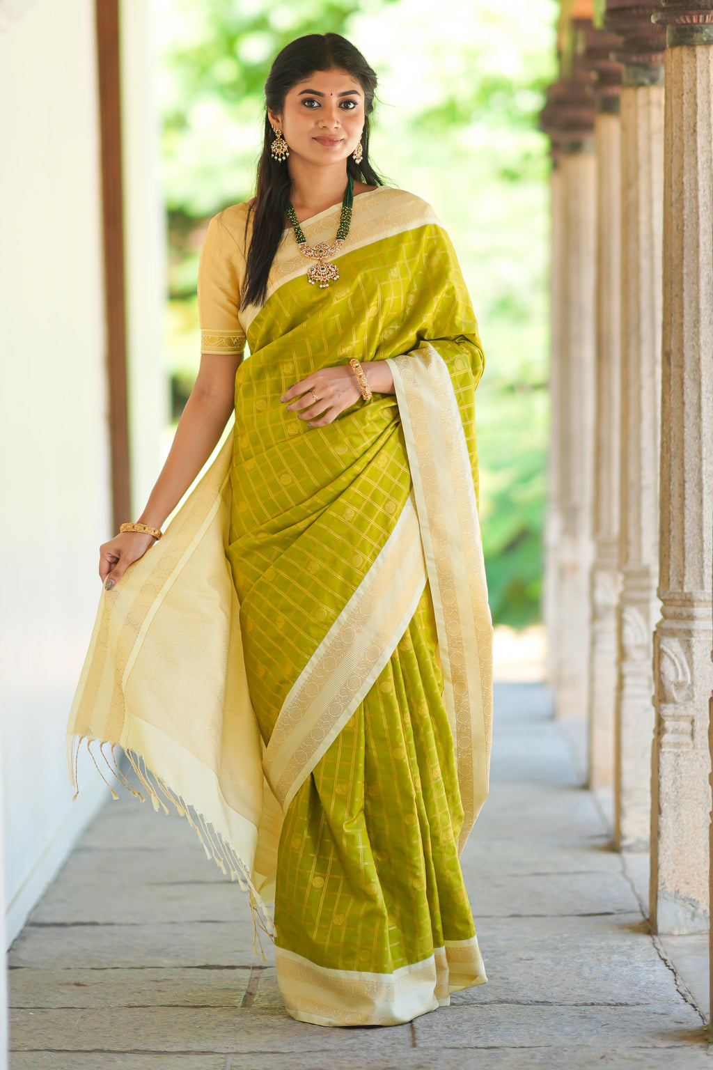 Green checked art silk saree with contrast zari border and blouse