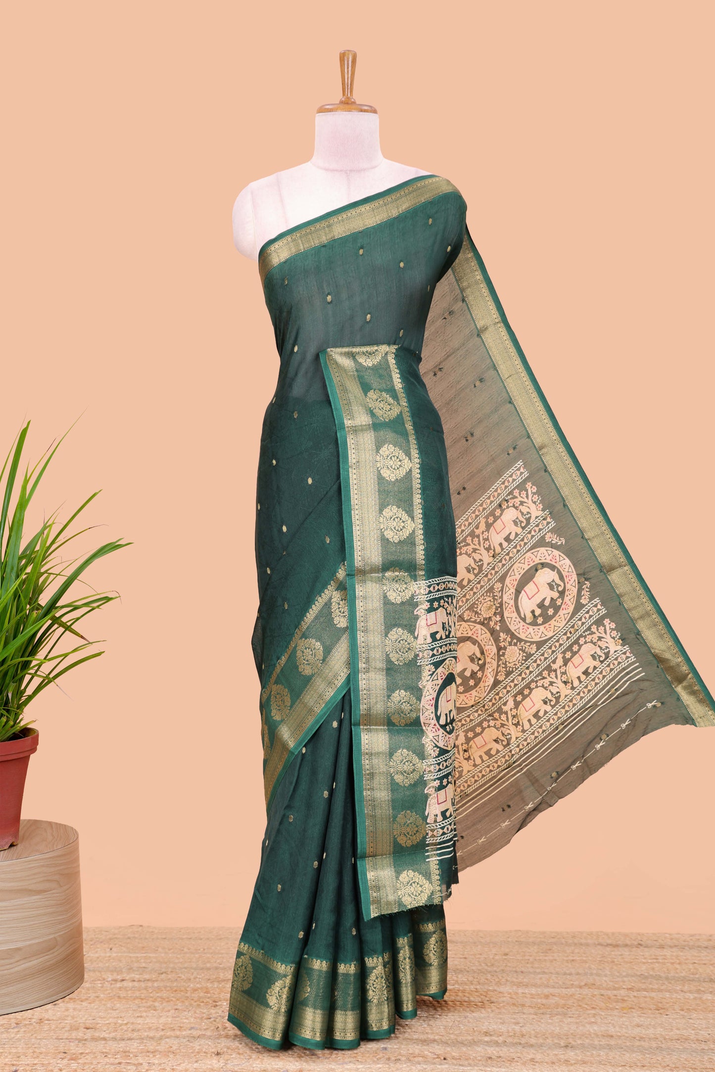 Green viscose dola silk saree with all-over zari butta, elephant motif pallu & contrast blouse
