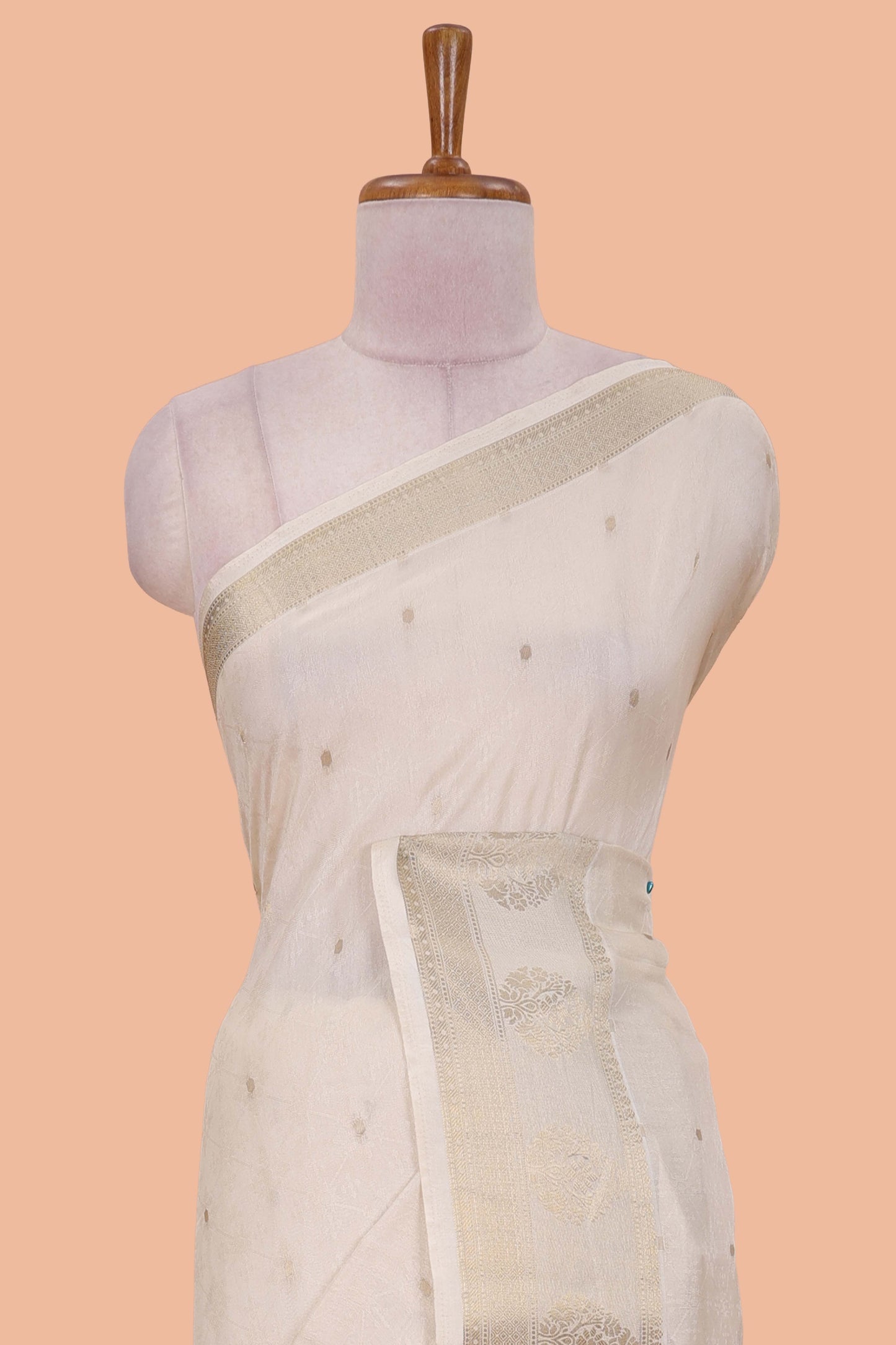 White viscose dola silk saree with all-over zari butta, elephant motif pallu & contrast blouse