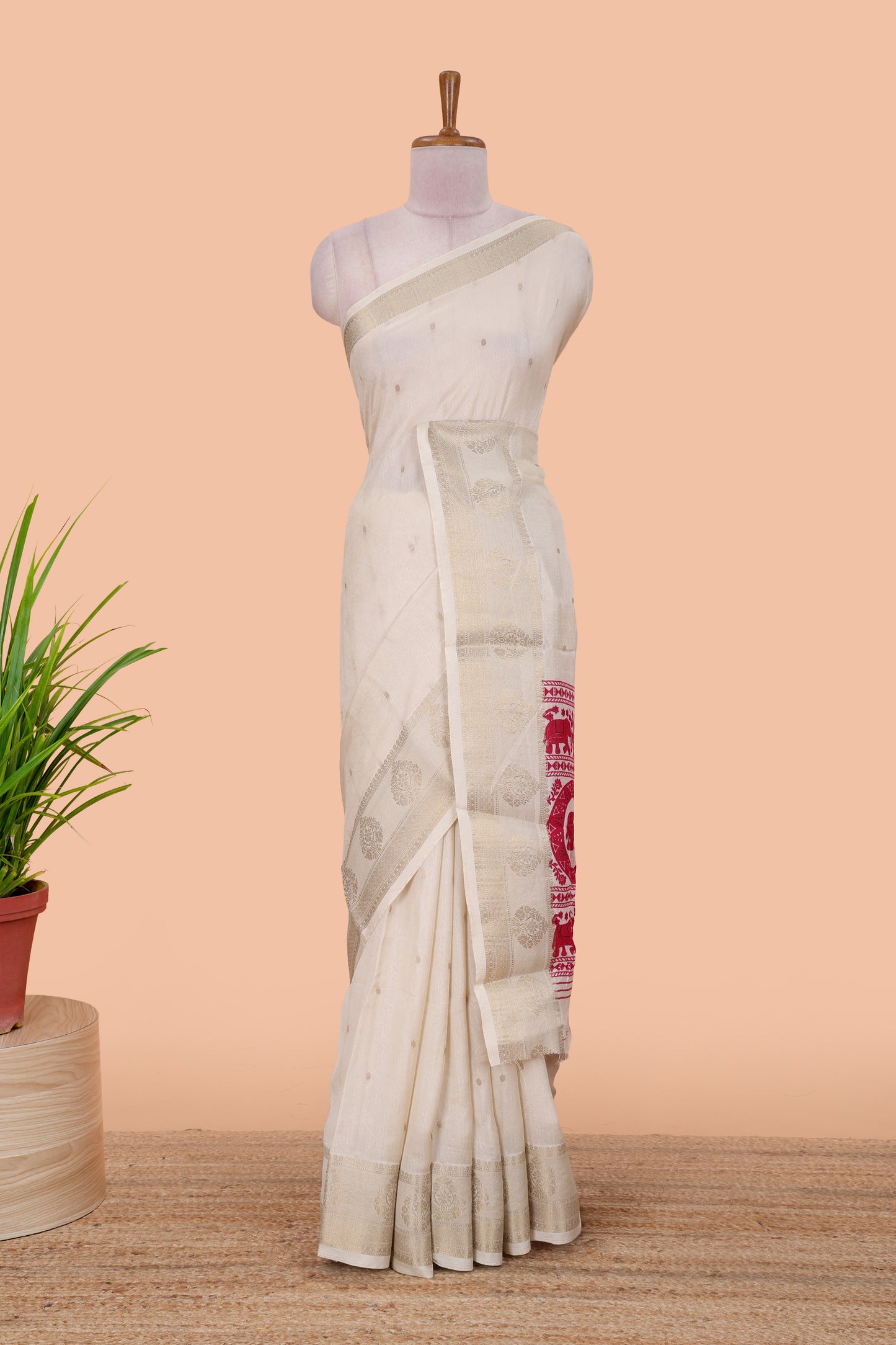 White viscose dola silk saree with all-over zari butta, elephant motif pallu & contrast blouse
