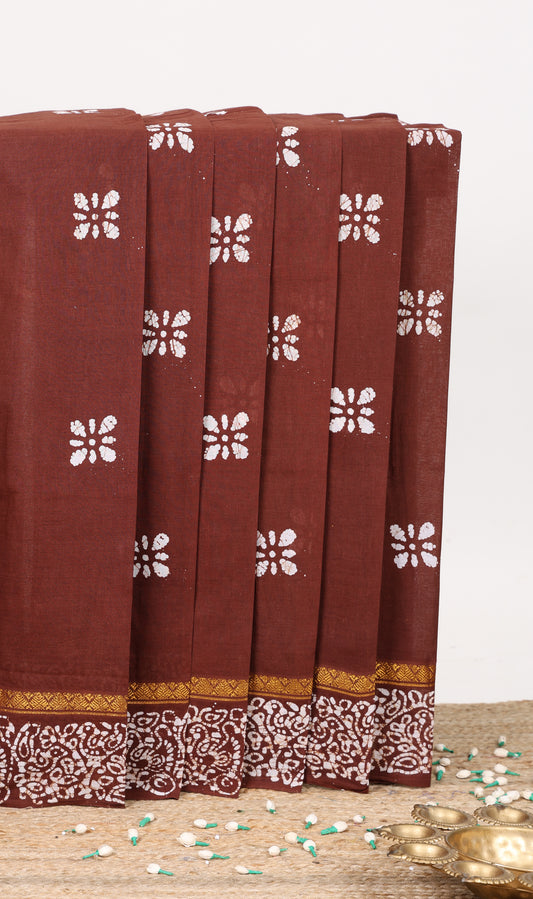 Maroon floral batik print sungudi cotton saree with self batik border and pallu