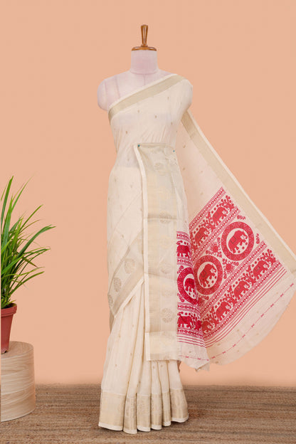 White viscose dola silk saree with all-over zari butta, elephant motif pallu & contrast blouse