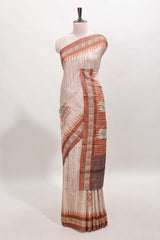 Tussar saree in beige tone delicate floral embroidery featuring rust-brown borders and woven pallu along with contrast blouse