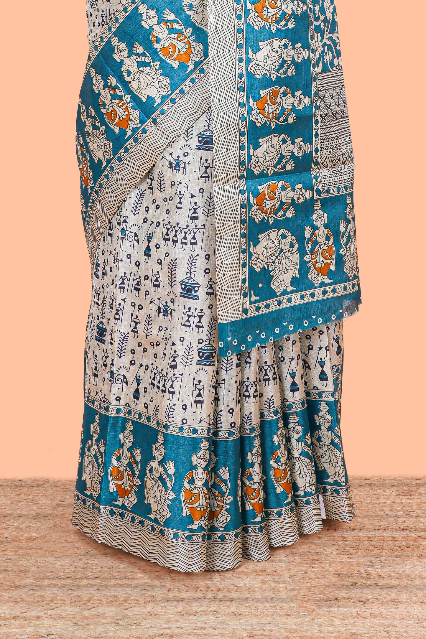 Cream khadi cotton saree with warli design print on body and pallu