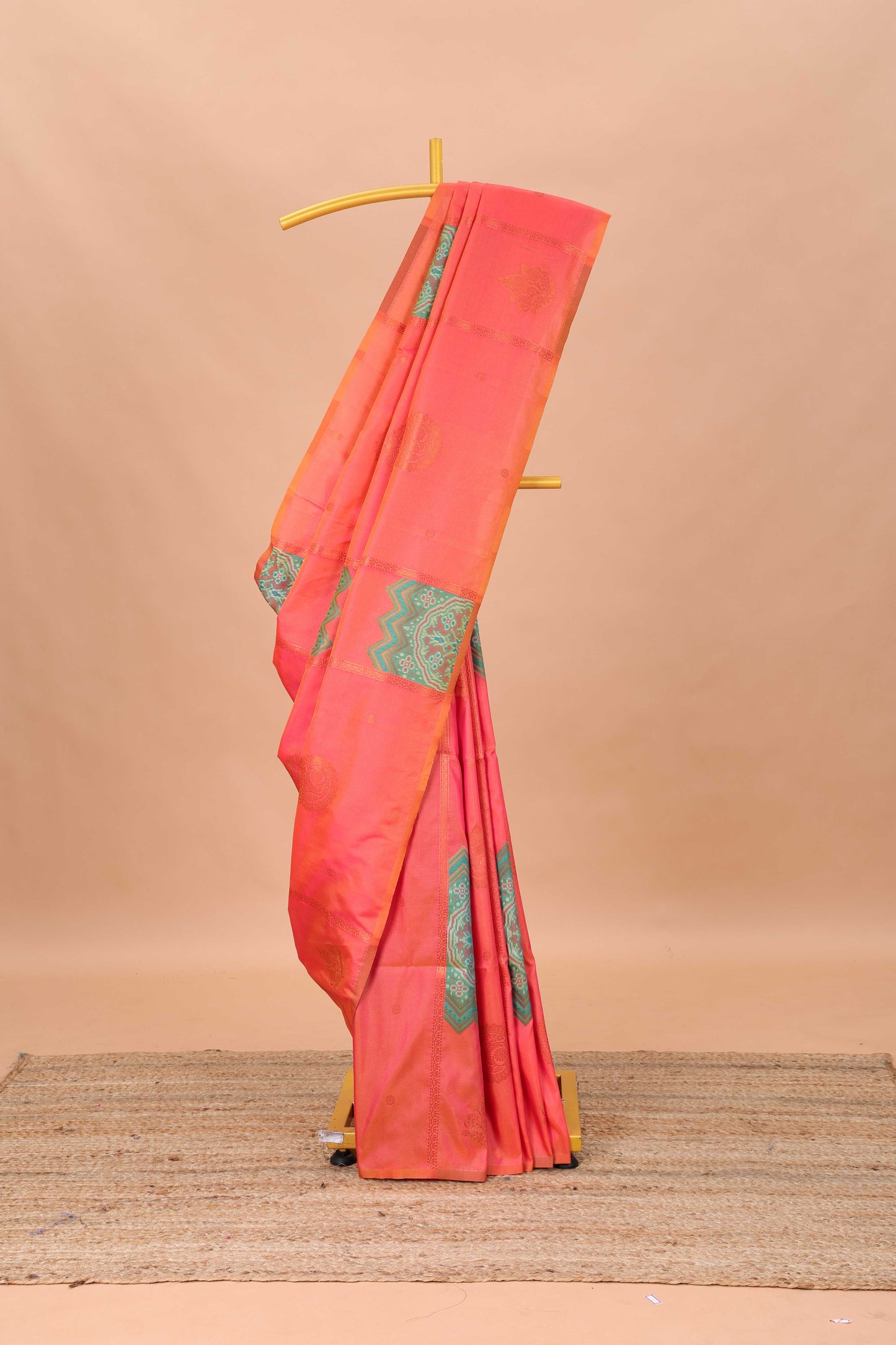 Borderless orange semi soft silk saree with ikkat and zari woven body and ogee pallu