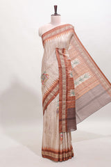 Tussar saree in beige tone delicate floral embroidery featuring rust-brown borders and woven pallu along with contrast blouse