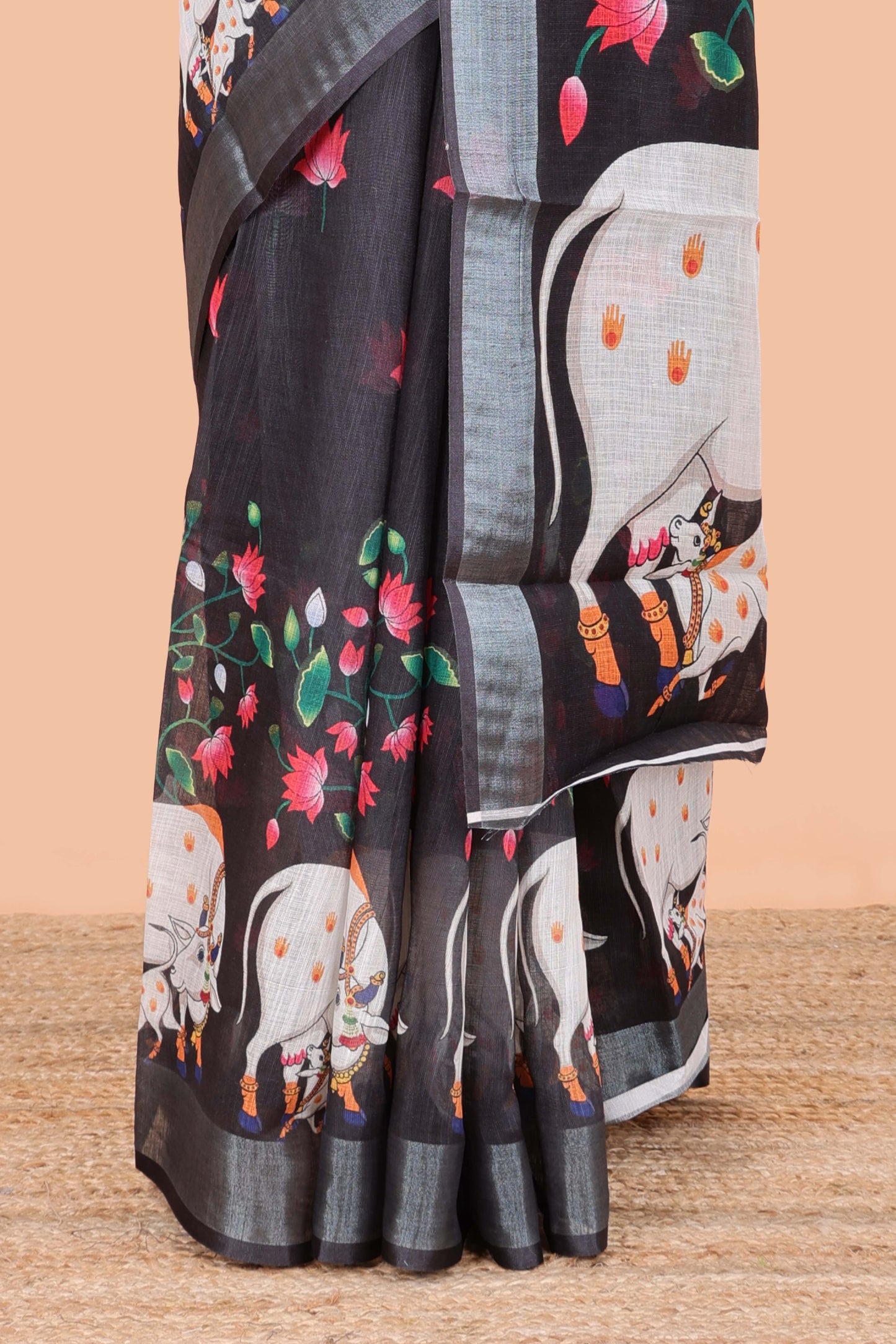 Black linen floral and animal themed print saree with zari border