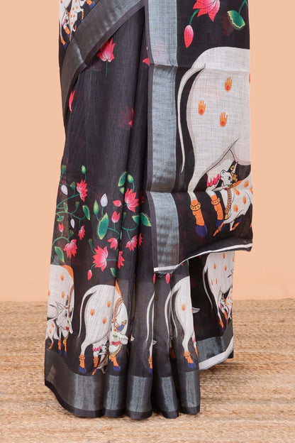 Black linen floral and animal themed print saree with zari border