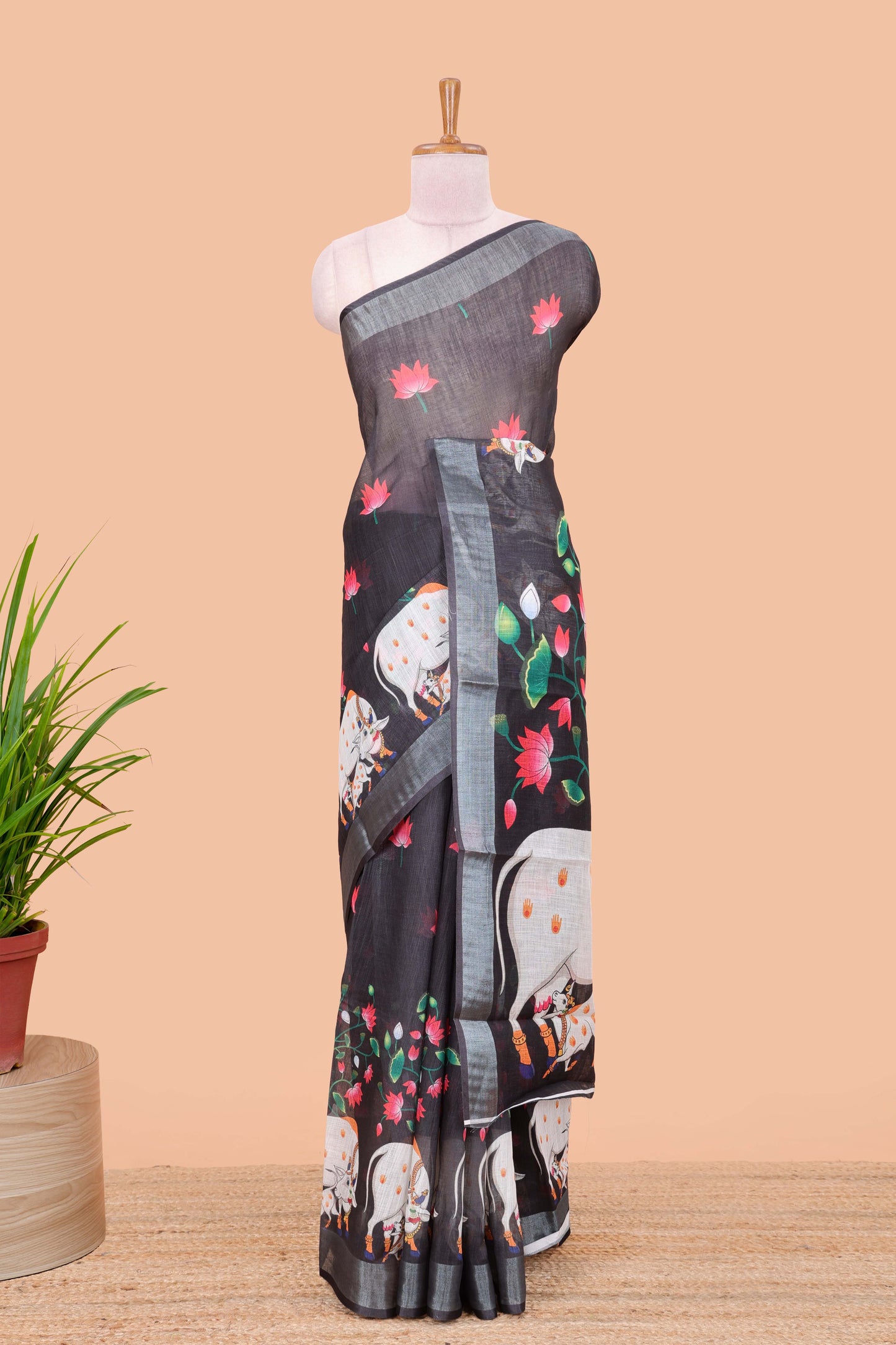 Black linen floral and animal themed print saree with zari border