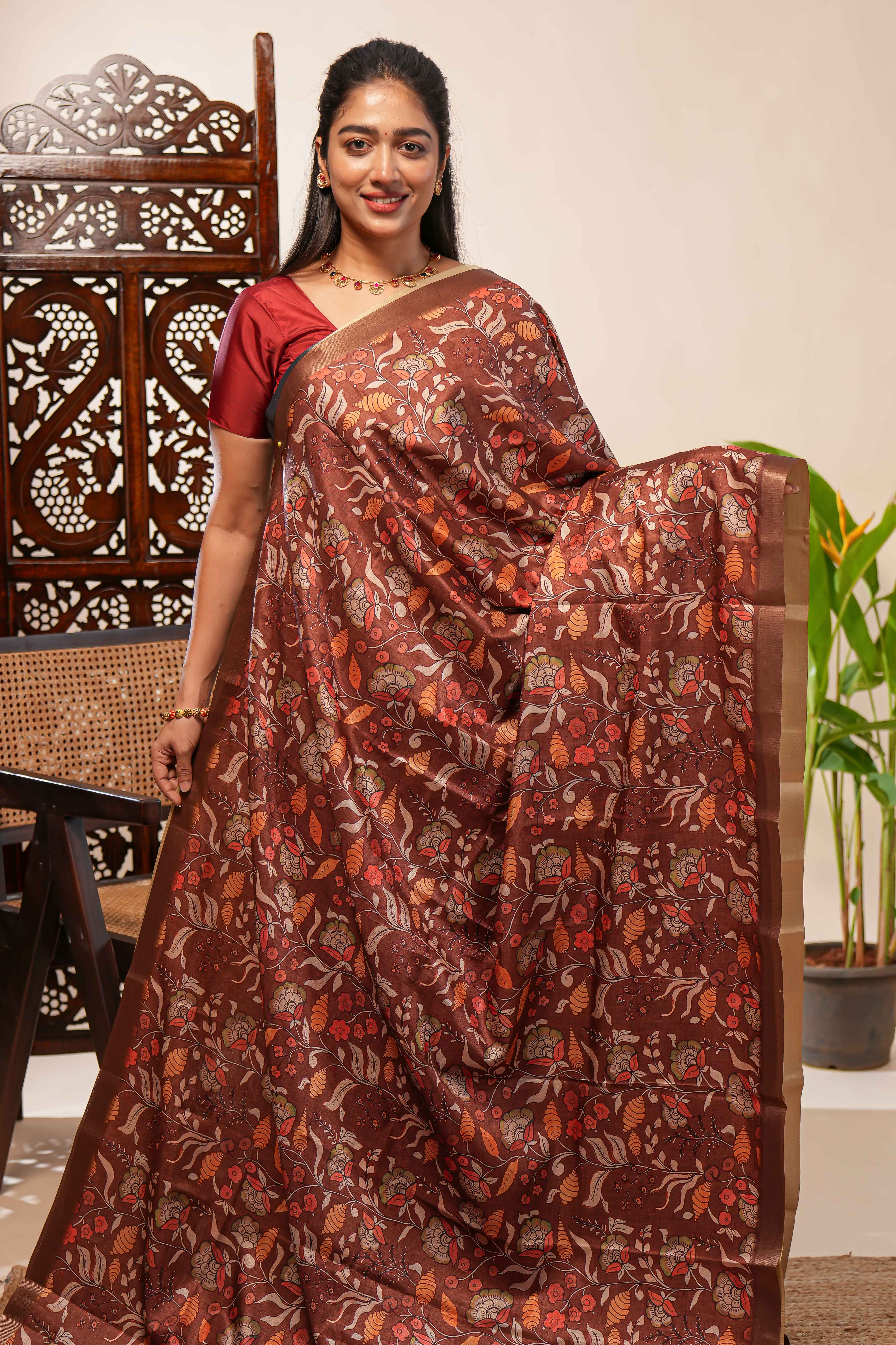 Brown floral design tussar saree with self zari border and matching blouse