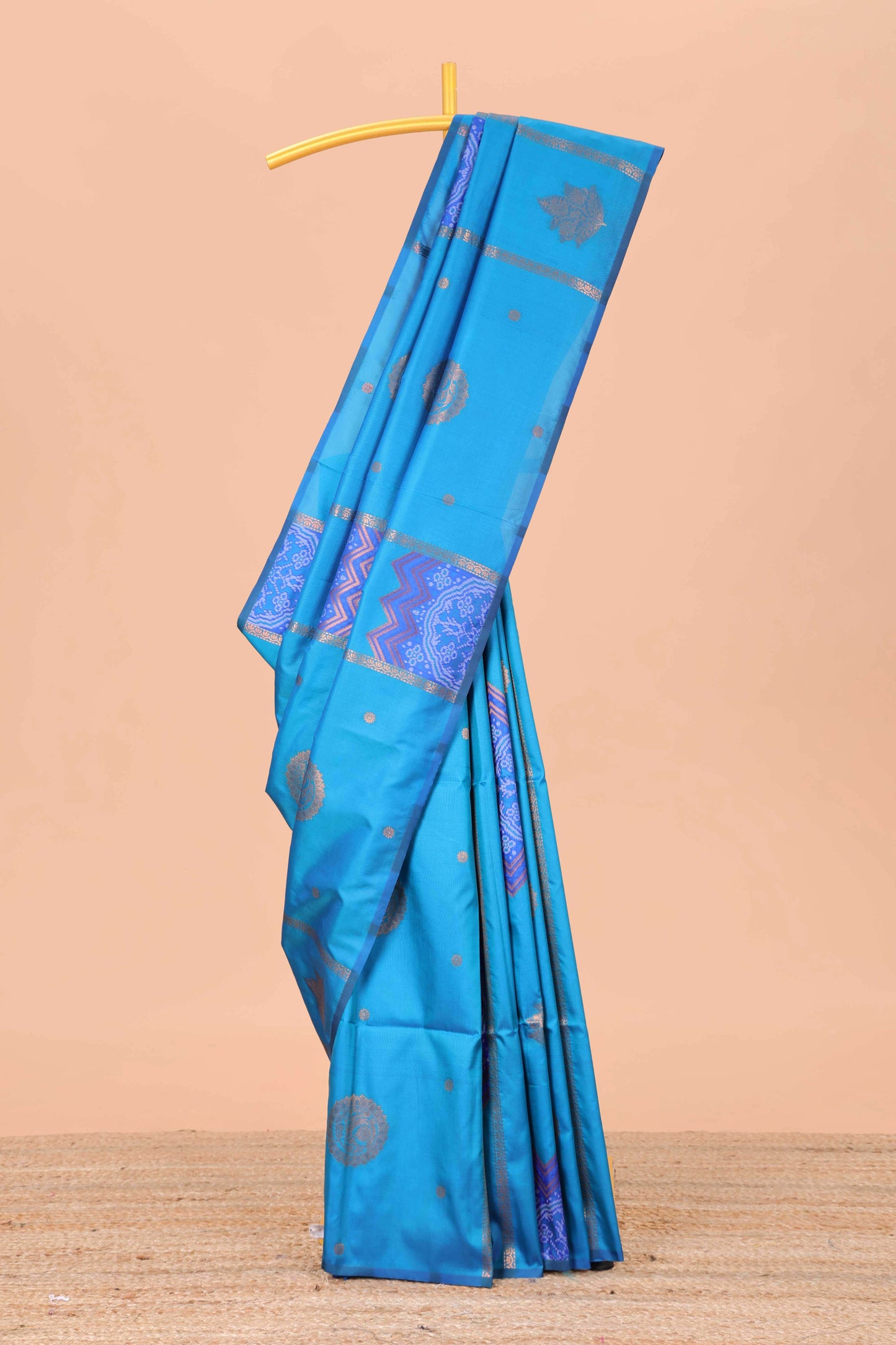 Borderless blue semi soft silk saree with ikkat and zari woven body and ogee pallu