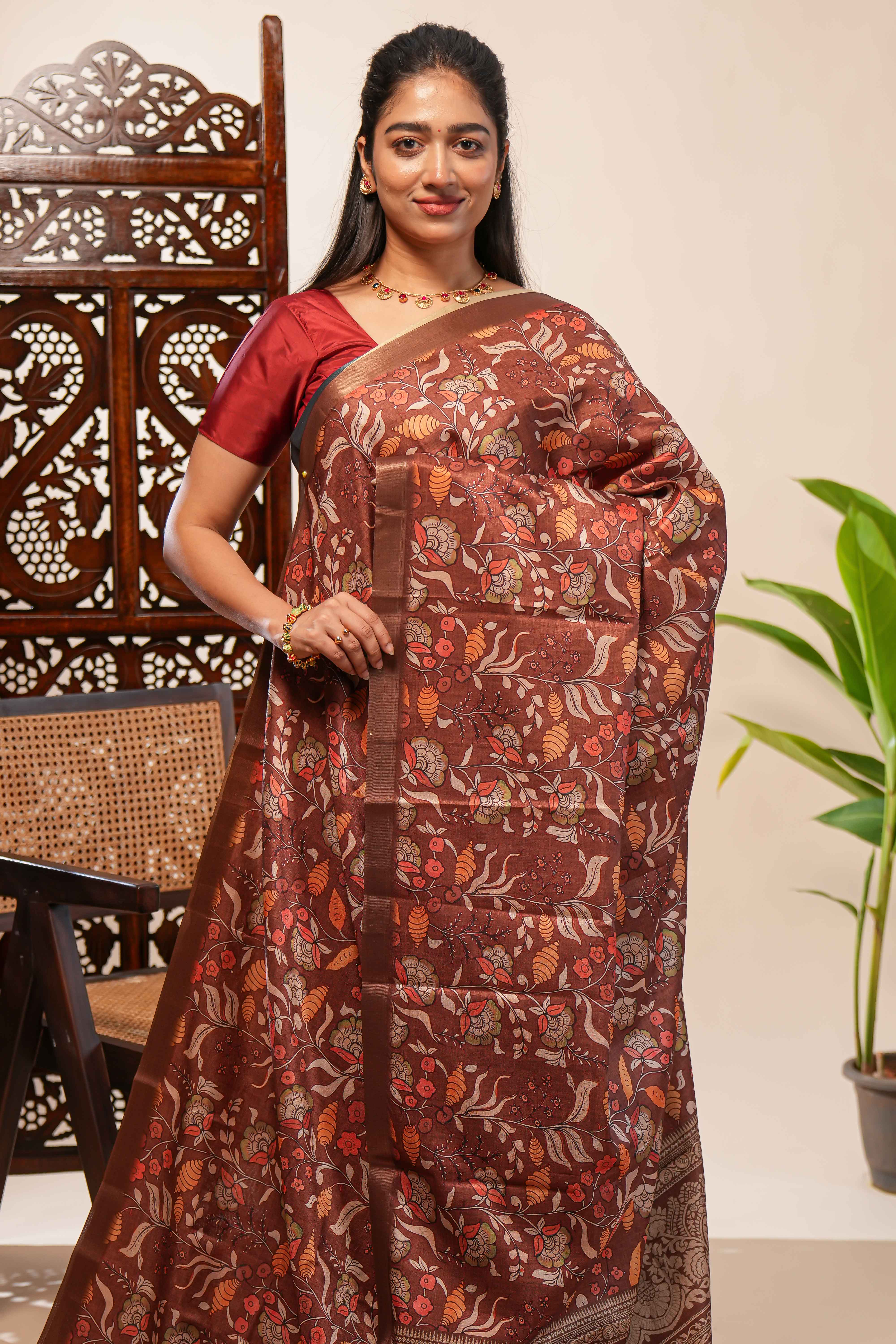 Brown floral design tussar saree with self zari border and matching blouse