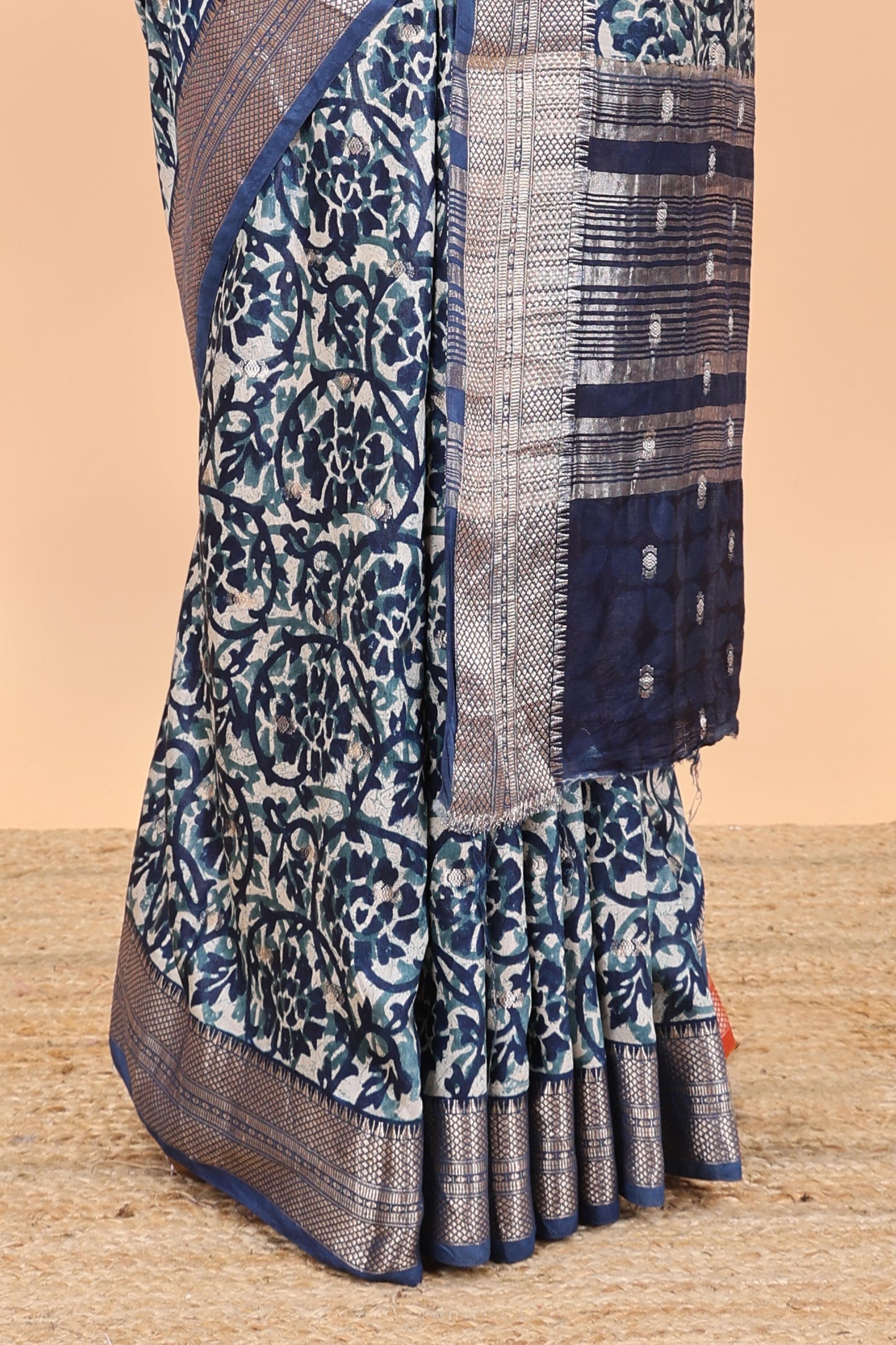 Cream chanderi cotton saree with floral vines, contrast zari border and striped pallu