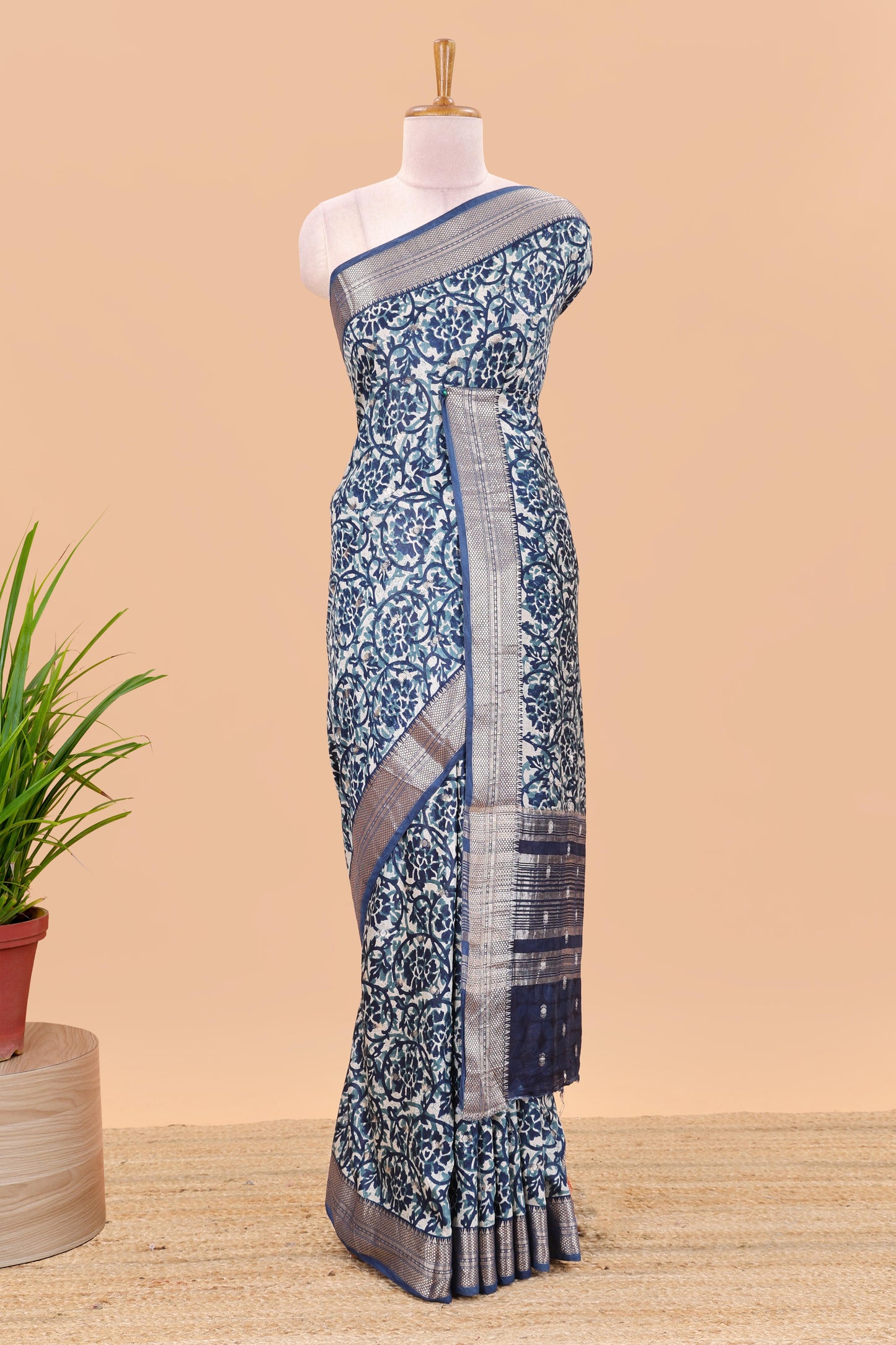 Cream chanderi cotton saree with floral vines, contrast zari border and striped pallu