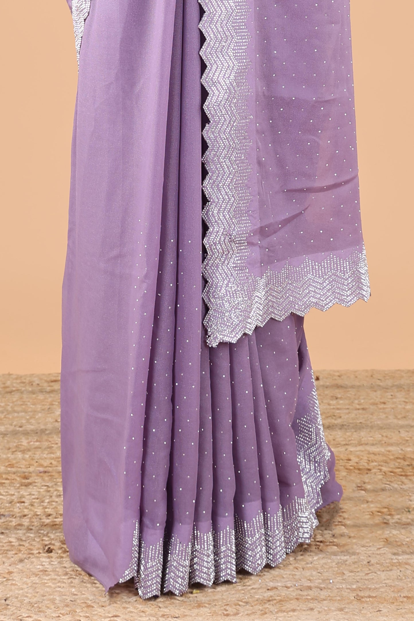 Lavender designer georgette space silk saree with heavy stone & beads work, short pallu and contrast sequin embroidered blouse