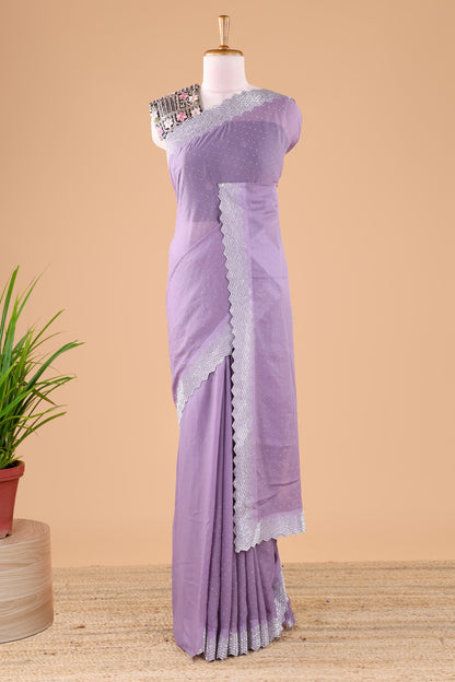 Lavender designer georgette space silk saree with heavy stone & beads work, short pallu and contrast sequin embroidered blouse