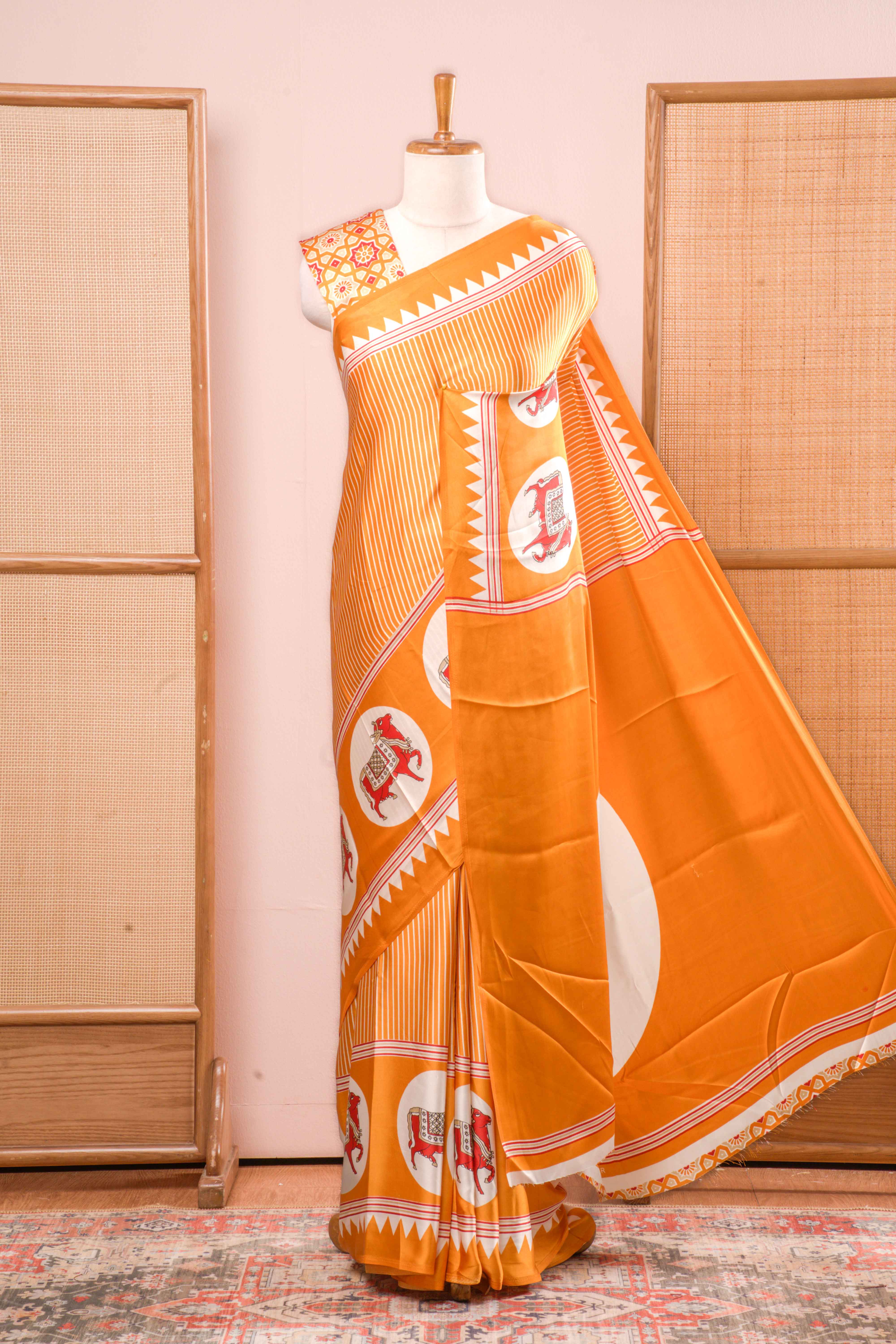 Vibrant Yellow Modal Silk Saree The Body Has Fine Vertical White Stripes The Border Are Highlighted Pichwai Design Along With Ajrakh Printed Blouse