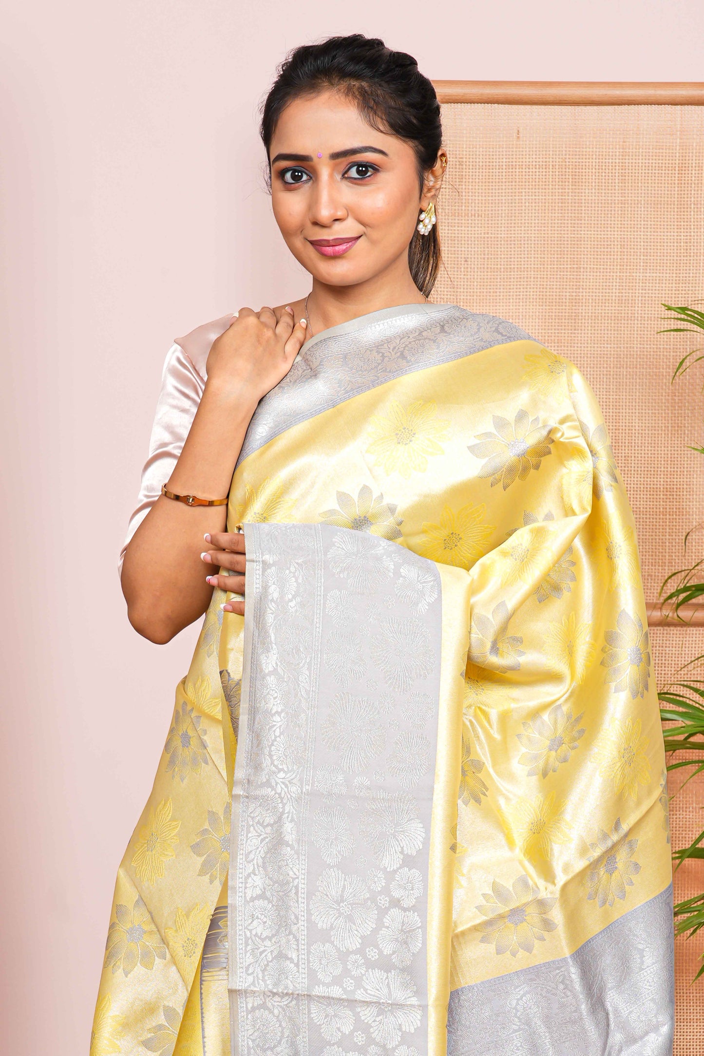 yellow tissue saree with silver zari