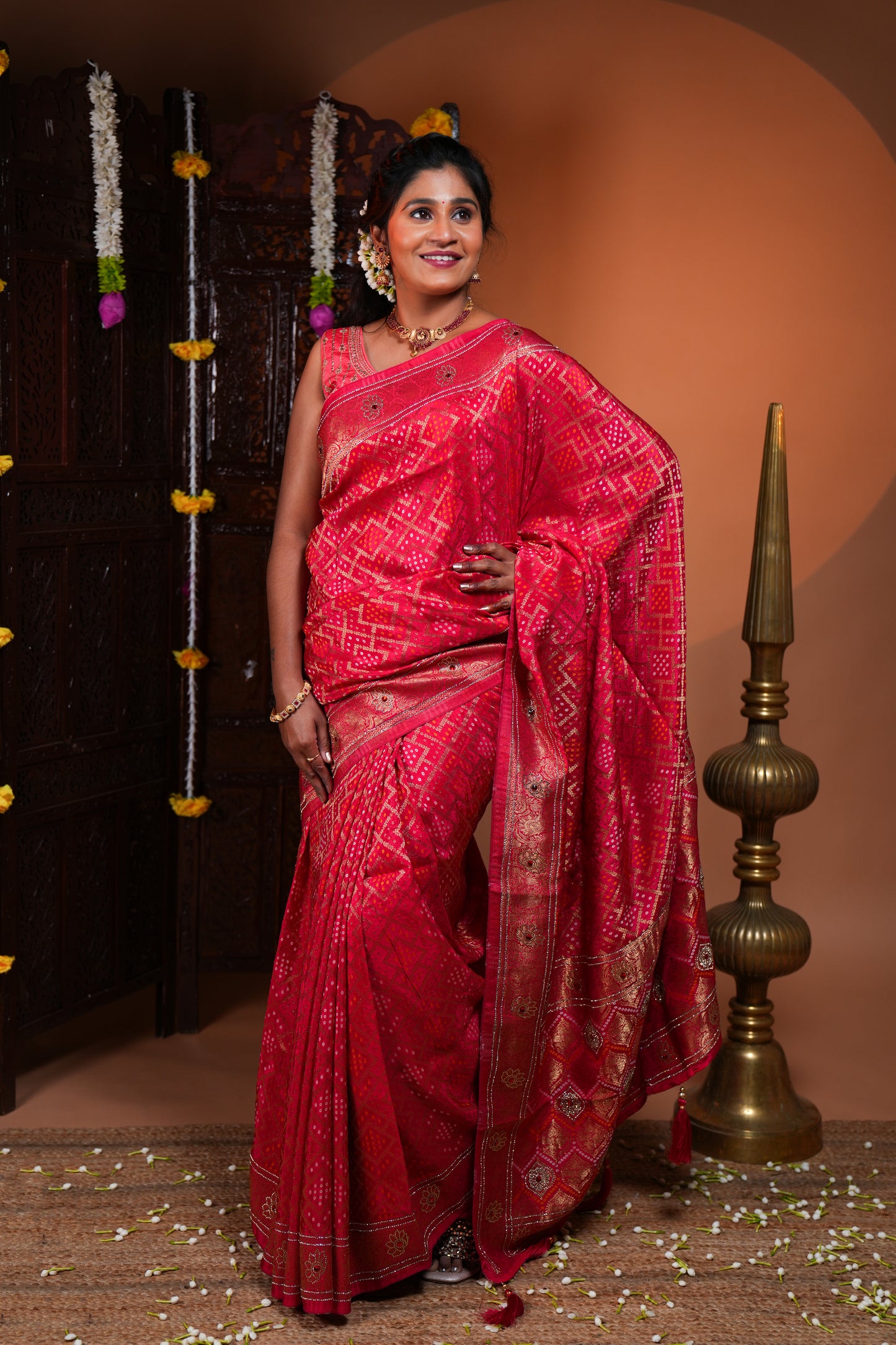 Rani pink bandhani style georgette saree with self stone work design border and pallu