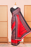 Black Modal Silk Saree The Body Has Ajrakh Design The Pallu Are Highlighted Vibrant Red Colour Along With Blouse