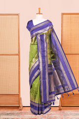 Green Semi Art Silk Saree Delicate Golden Zari Motifs Along With Thalampoo Zari Woven Across The Body. The Border Is Broad With Intricate Floral Zari Weaving Rich Golden Zari Pallu