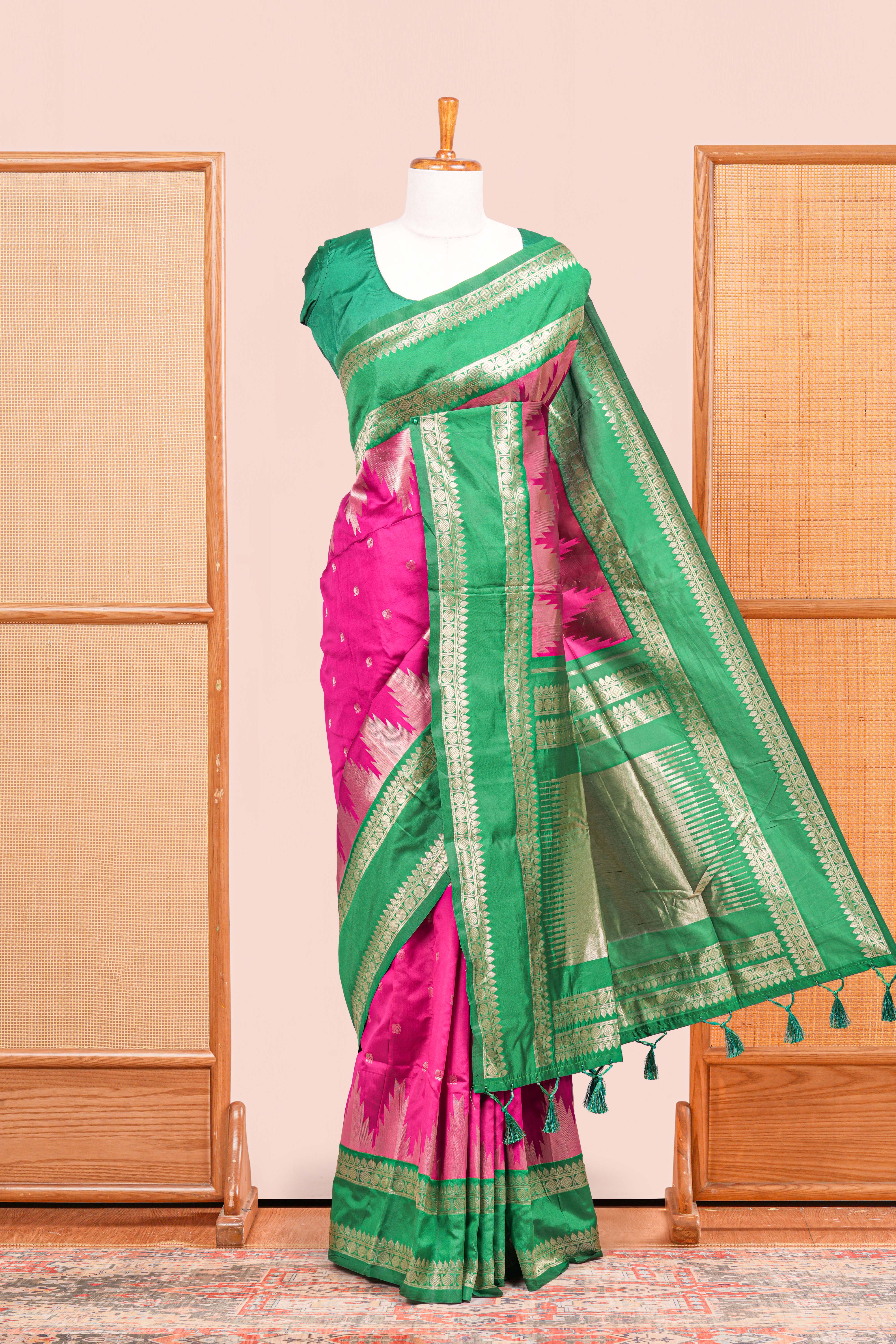 Pink Semi Art Silk Saree Delicate Golden Zari Motifs Along With Thalampoo Zari Woven Across The Body. The Border Is Broad With Intricate Floral Zari Weaving Rich Golden Zari Pallu