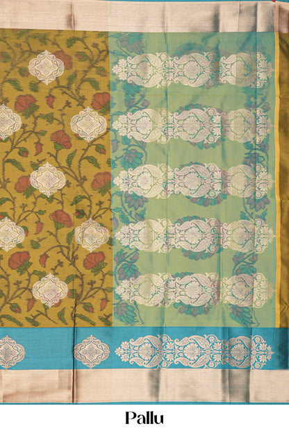 Saree with floral and geometric patterns in green, yellow, and blue