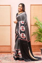 Black Modal Silk SareeThe Body Has Fine Vertical White StripesThe Border Are Highlighted Pichwai Design Contrast Coin Motifs In PalluAlong With AjrakhPrinted Blouse