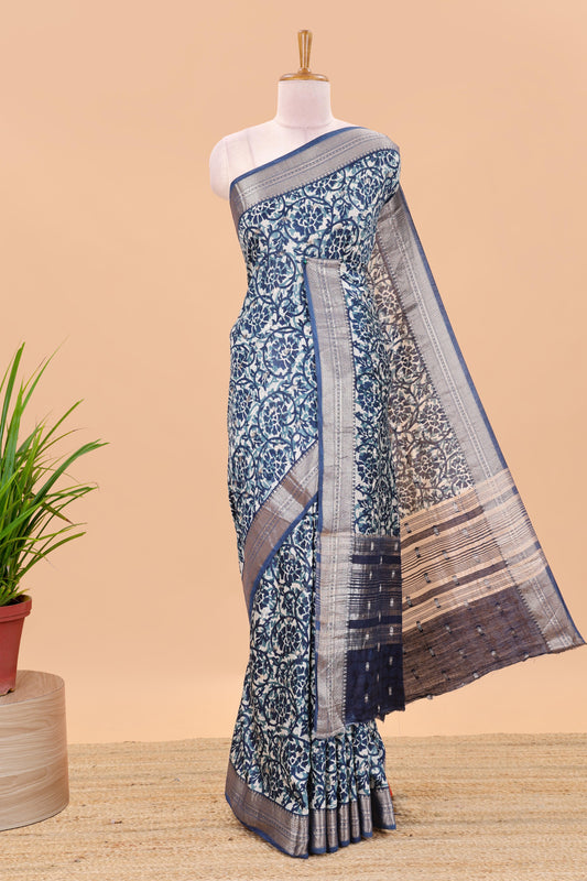 Cream chanderi cotton saree with floral vines, contrast zari border and striped pallu