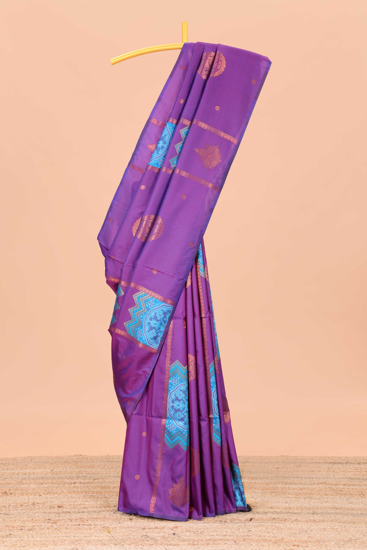 Borderless magenta semi soft silk saree with ikkat and zari woven body and ogee pallu
