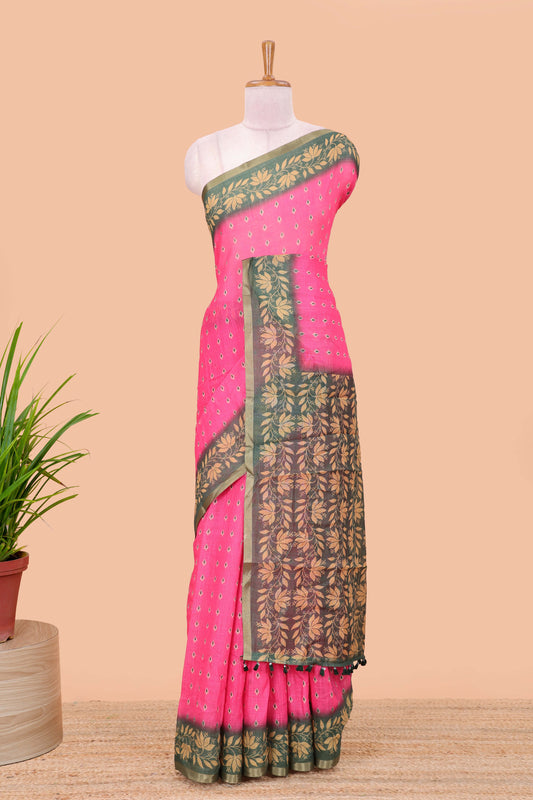 Pink linen saree with all-over butta print, contrast border, printed pallu, and contrast blouse