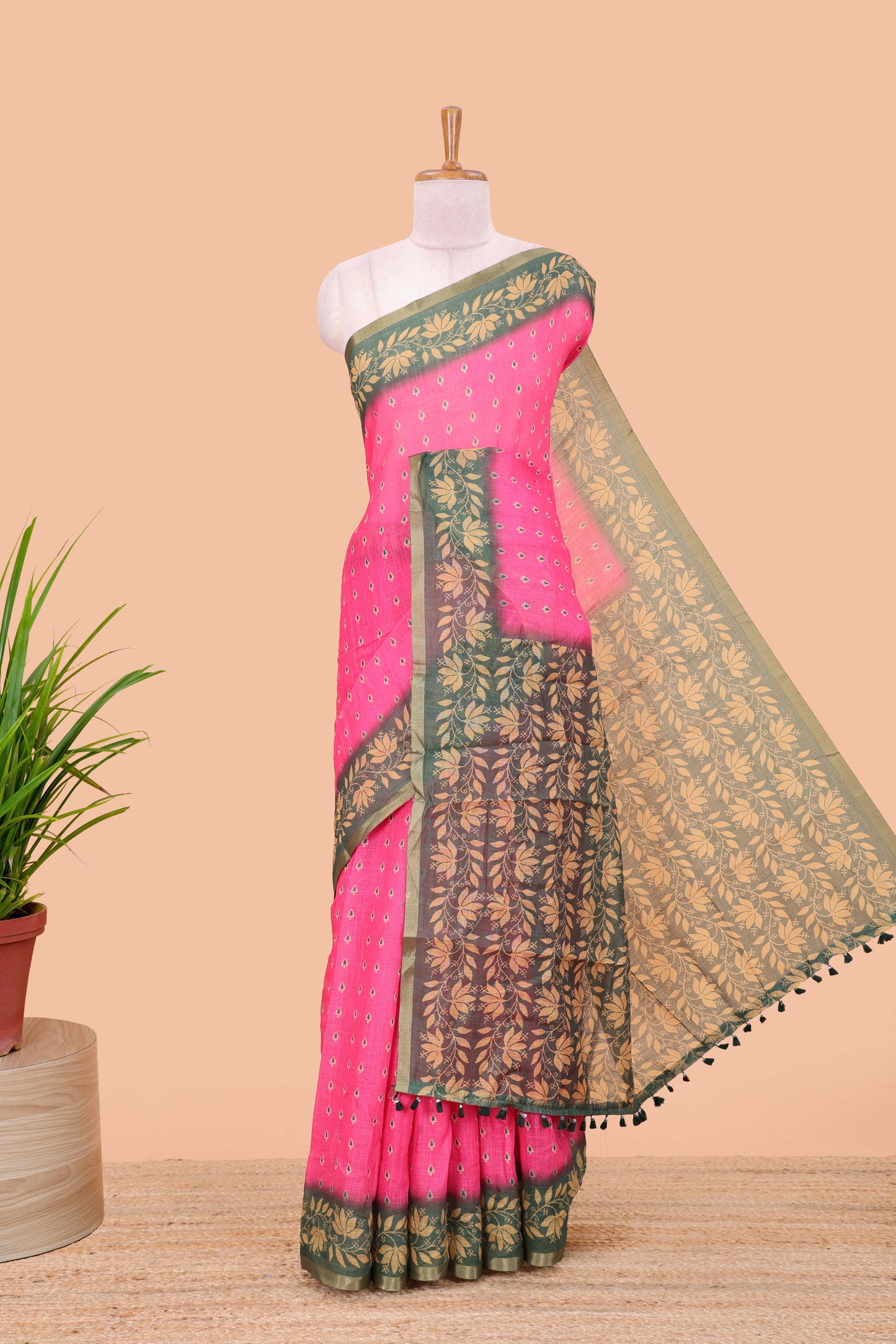 Pink linen saree with all-over butta print, contrast border, printed pallu, and contrast blouse