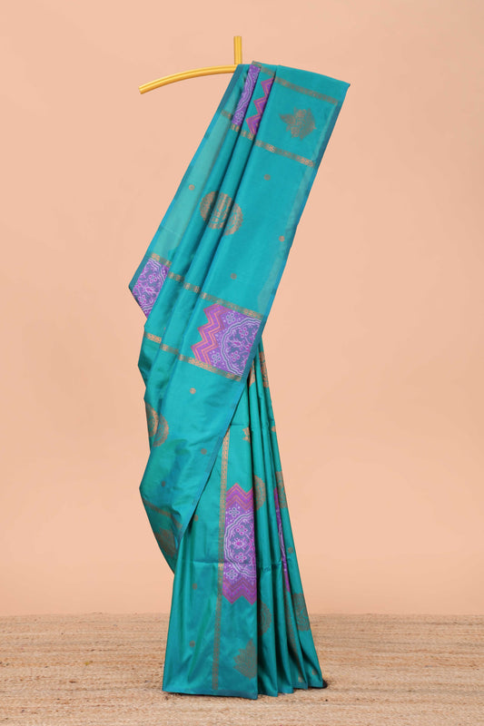 Borderless green semi soft silk saree with ikkat and zari woven body and ogee pallu
