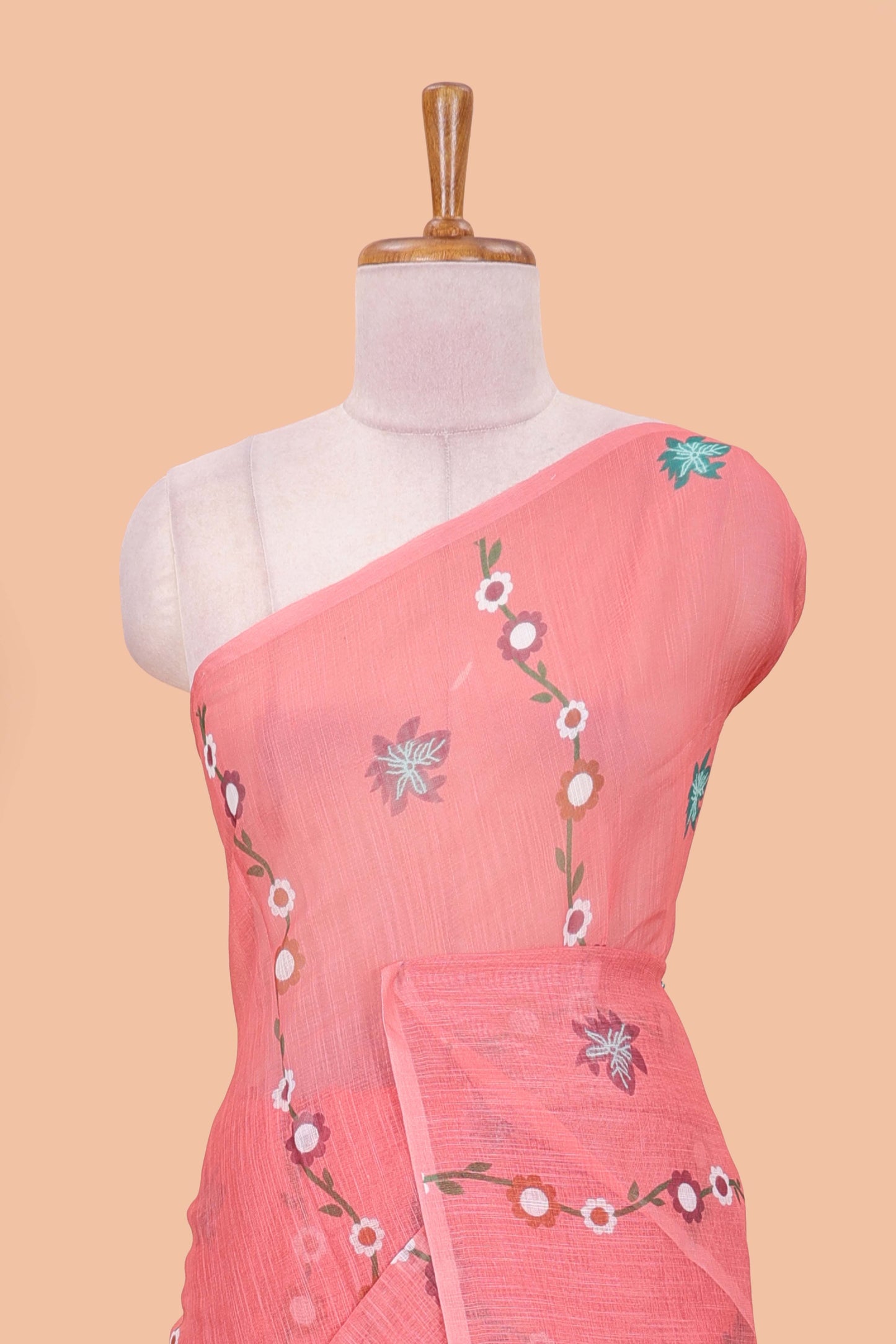 Borderless pink linen saree with floral design, printed pallu and blouse