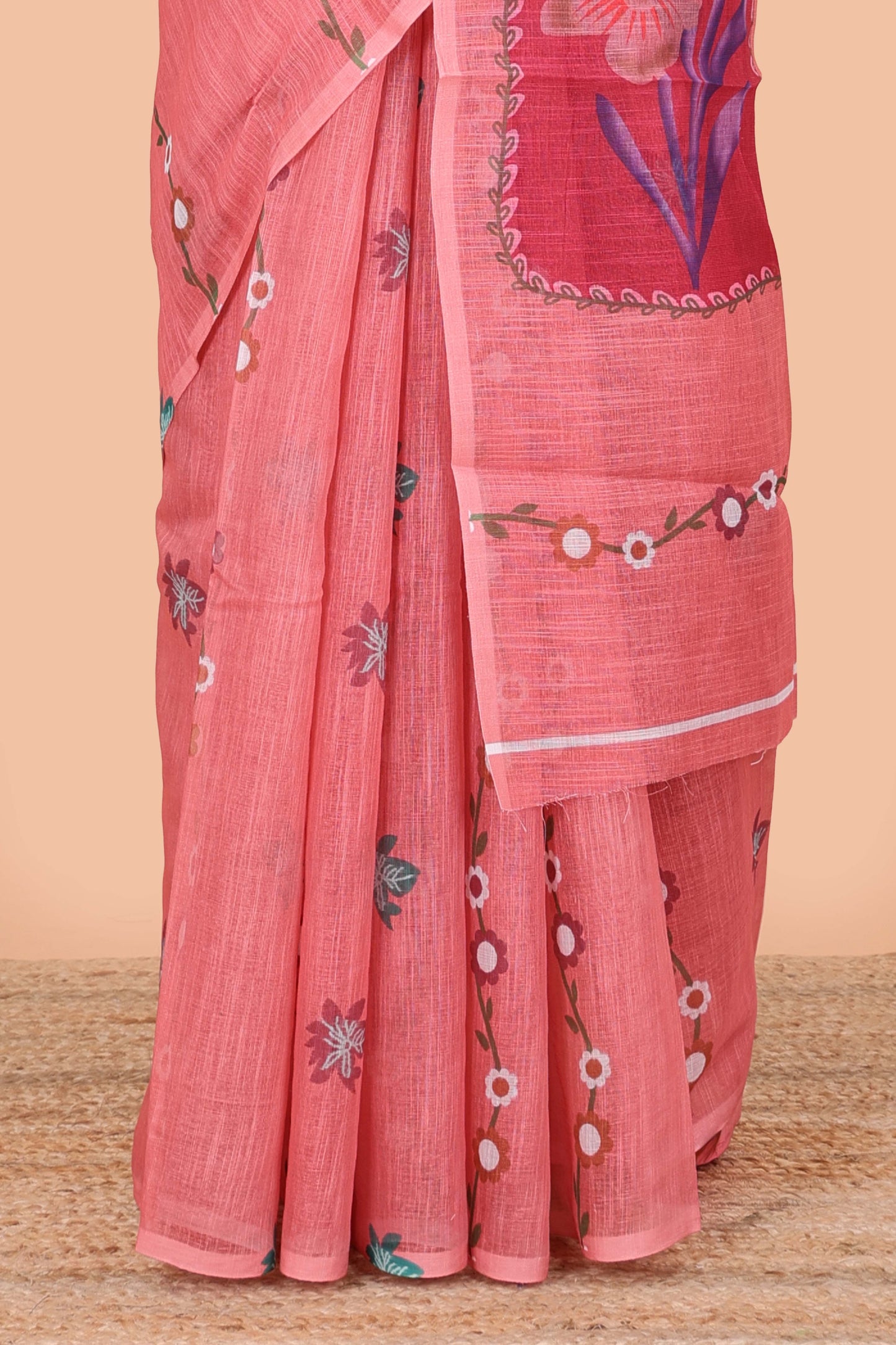 Borderless pink linen saree with floral design, printed pallu and blouse