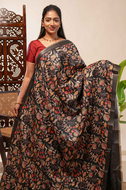 Black floral design tussar saree with self zari border and matching blouse