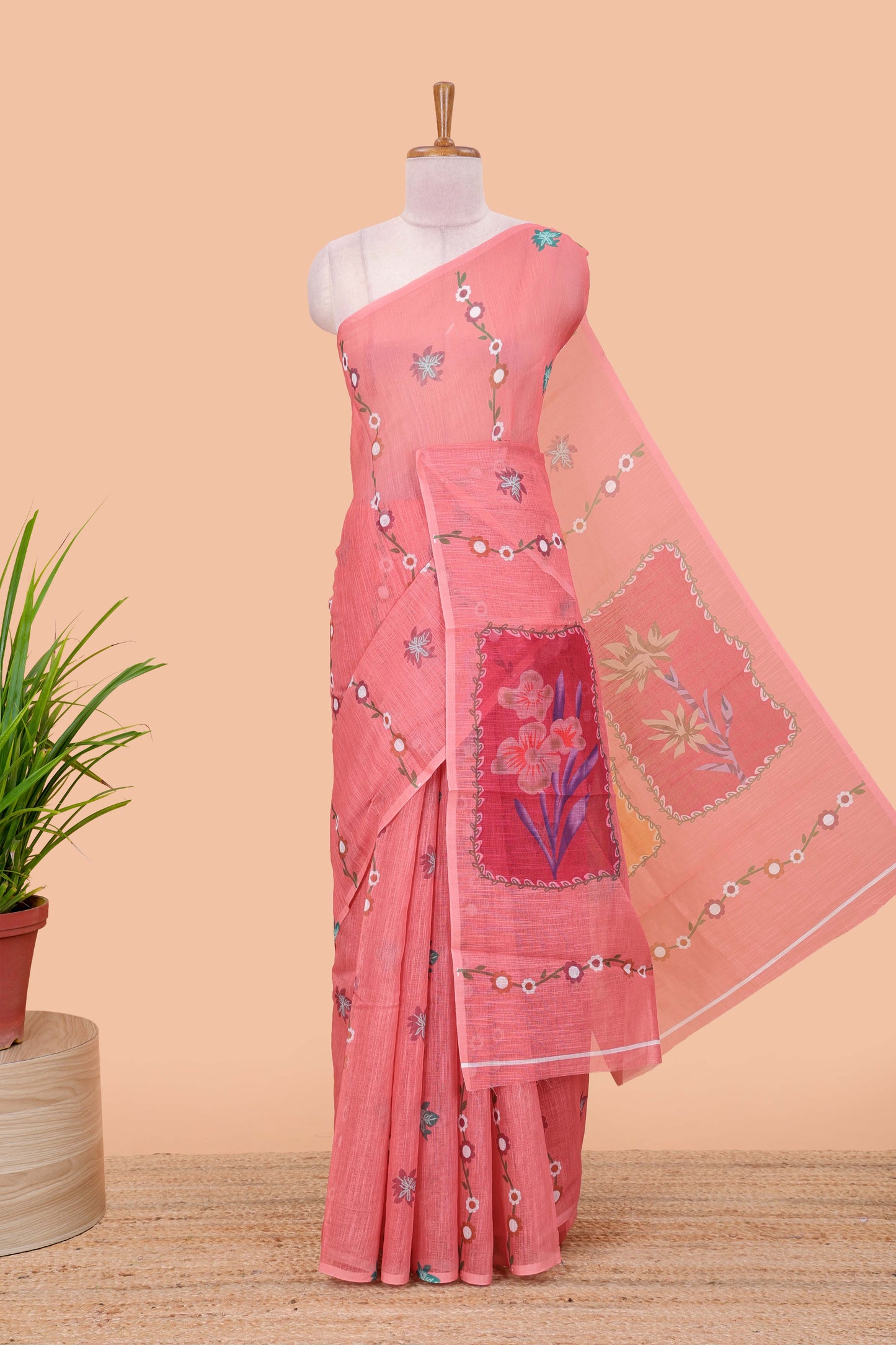 Borderless pink linen saree with floral design, printed pallu and blouse